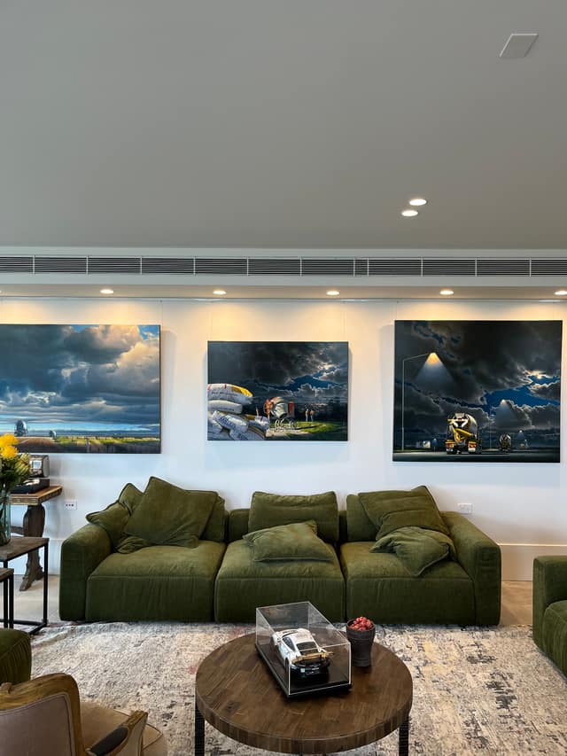 Living room with rail system holding large artworks